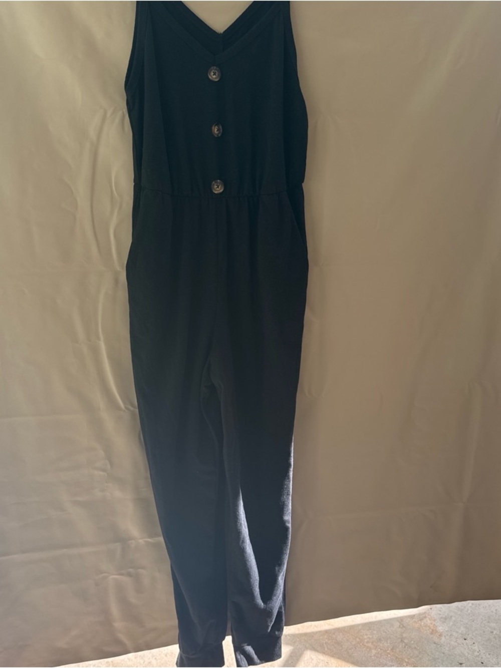 Sleeveless Black V-Neck Button-Front Jumpsuit